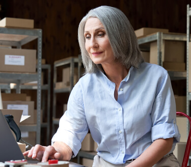 Grey haired woman in blue shirt